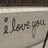 A split-screen image with handwritten text on the left and pixelated text on the right, both conveying a romantic message.