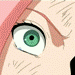 Anime-style close-up of a character's eye with green iris and black pupil, showing subtle animation changes