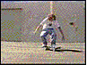 A person in a white shirt and blue jeans performs a skateboard trick across six showing motion from ground to air