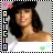 Pixelated portrait of a person with long dark hair wearing a dark headband, surrounded by a black-and-white checkered border with colored symbols.