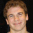 Pixelated portrait of a person with light brown hair against black background, accompanied by pixelated text reading 'ShAnE+ kIpPeL= Love' on right side.
