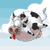 Pixelated cow head with black-and-white spots, pink nose, red tongue, and small horns, set against light blue sky with white clouds.