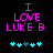 Pixelated text "I LOVE LUKE B." in bright pink on black background with cyan and teal heart symbols below.