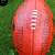 A football-shaped icon with visible laces on a grass background, featuring green text reading "Love" and "football" in different frames.