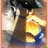 Pixelated static image of two figures in close embrace, one in dark clothing with light hair, the other in yellow and blue attire, against a blurred background.