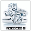 Static image of two diamond rings with silver bands, one ring positioned above the other, set against a white background with text at the bottom.