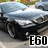 Pixelated image of a silver car with visible wheels and headlights, featuring bold black text 'EGO' in the bottom right corner.