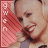 Pixelated static image of a person with light skin and dark hair, wearing a red garment over the shoulder, with vertical text on a pink background.