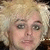 A pixelated image shows a person with blonde hair on the left, next to text reading "Blonde Billie" and a yellow heart symbol on black background.
