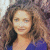 A pixelated image of a person with long brown hair wearing a blue top, next to green text reading 'Original Icons .com' on a dark background.