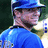 A pixelated image of a person in blue sports attire with a helmet, showing text overlay changes