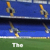 A stadium scene with blue seats and yellow structural elements, showing sequential text changes on a green field overlay.