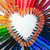 A heart-shaped icon with a rainbow gradient background and white outline, transitioning to grayscale with a neon heart outline.