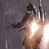 Pixelated static image of a humanoid figure with glowing light effects against dark background, likely from Star Wars media.