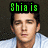 A pixelated image of a person in a light blue shirt with green, cyan, and red text overlays above or below the head.
