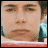 Pixelated image of a person with dark hair and light skin, alongside blue text reading "i'm the next..." and black pixel art text "mrs. adam brody" on white backgrounds.