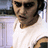 A person in a white sleeveless shirt with dark shoulder patches appears in two vertical , the lower showing more of their face and chest