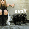 A static image of a person crouching against a textured wall with 'avril' text, featuring a small inset video frame showing the person's face and upper body.
