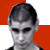 A static image shows a person with short dark hair against red and white background, with a central logo reading "FIZIKS" below a stylized black symbol containing a red circle.