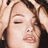 A woman with closed eyes and parted lips, her hand raised to her head in a stylized pose across four