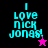 Four pixelated display "I Love Nick Jonas!" text with star symbols on black, purple, pink, and dark purple backgrounds