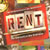 Static 50x50 pixel buddy icon featuring the word "RENT" in bold dark letters on a light background, framed by a red border with orange and yellow gradient accents.