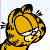 Pixelated orange cat with black stripes and white teeth grins against light blue background with white dots.