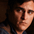 Animated contact sheet of a 3x3 grid showing frames from an icon featuring Joaquin Phoenix's character, red blood-like streaks, and "THE VILLAGE" text on dark backgrounds.