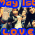 Pixelated image with blue banner text 'May 1st' top and 'LOVE.' bottom, featuring multiple figures in dark clothing against a light background.