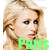 Pixelated close-up of a person with light brown hair and dark eyes, wearing green text reading 'Paris' over the lower face.