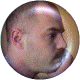 A circular icon with a person's face in profile view, transitioning through multiple states of rotation and color variation.