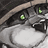 Static pixelated icon of a gray cat's face with glowing green eyes and black markings, set against dark background.