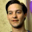 A 48x48 pixel buddy icon split into two frames showing a person on the left and green text on a dark background on the right, with visible pixelation and dithering effects.