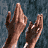 Animated contact sheet showing a person's arms raised in multiple frames with a V-for-Vendetta symbol below, all on a gray background.