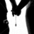 Black-and-white animated icon shows a figure in a suit with a white shirt and black tie, holding a small object that moves vertically.