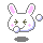 Pixel art bunny head with closed eyes, pink inner ears and cheeks, white body, green cross-shaped pupils, light blue outline, gray background.