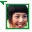 Pixelated portrait of a person with dark hair in green-bordered frame, showing two sequential facial expressions.