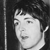 Black-and-white pixelated image of a person's face in profile view with dark hair, visible ear, and neck, set against a dark background with a vertical light stripe on the left.