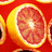 Pixelated fruit image with orange text reading 'go bananas!', 'it's an orange', and 'idiot :-P' on a light background.