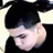 Pixelated static image of a person with short dark hair and light skin, wearing a black top against a pale background.