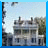 A pixelated image split into two sections: left shows a building with multiple windows and chimneys under a light blue sky, right displays the word 'promised' in stylized pink and black text.