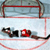 Static 50x50 pixel icon depicting a hockey rink with goal net, puck, and stick on ice surface.