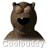 Two side-by-side animated frames of a brown cartoon bear mascot with closed eyes on the left and wide open eyes on the right, both showing a large black mouth opening and white teeth, with "COOLBUDDY" text below in pixelated style.