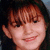 A person with brown hair and bangs appears in three distinct facial expressions across a