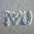 Pixelated static image with blue and white text on a gray background, showing partial letters 'I', 'M', 'U' in a stylized font.