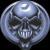 Pixelated circular icon shows a metallic skull with glowing eyes and teeth, set against a black background with a silver border.