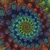 A pixelated circular pattern with concentric rings of blue, green, and brown hues on a dark background.