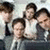 Six people in a group pose on the left, with bold text 'THE OFFICE' on a blue background to the right.