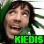 Pixelated image of a person with dark hair and green foliage background, featuring bright green text reading 'MEDI5' at the bottom.
