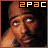 Pixelated image of a person with light brown skin and dark hair, wearing a headband, holding hand near face; text '2PAC' above in orange and white block letters.